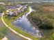 Aerial view of condo community with a peaceful canal at 200 Silver Lake Dr # 105, Venice, FL 34292