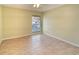 Bright bedroom with tile flooring and window with blinds at 2066 Sunset Point Rd # 91, Clearwater, FL 33765