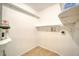 Laundry room with shelving and hookups for washer and dryer at 2066 Sunset Point Rd # 91, Clearwater, FL 33765