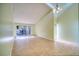 Spacious living room with tile floors and sliding glass doors at 2066 Sunset Point Rd # 91, Clearwater, FL 33765