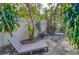 Relaxing patio with seating area and tropical landscaping at 2066 Sunset Point Rd # 91, Clearwater, FL 33765