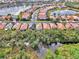 Aerial view of community with lake and homes at 2136 Mesic Hammock Way, Venice, FL 34292