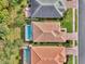 Aerial view of houses and pools from above at 2136 Mesic Hammock Way, Venice, FL 34292
