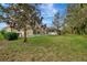 Large backyard with pool and lush landscaping at 2136 Mesic Hammock Way, Venice, FL 34292