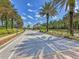 Gated community entrance with palm trees at 2136 Mesic Hammock Way, Venice, FL 34292