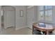 Bright foyer with a round table, chairs, and access to other rooms at 2136 Mesic Hammock Way, Venice, FL 34292