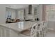Modern kitchen island with white cabinetry and quartz countertops at 2136 Mesic Hammock Way, Venice, FL 34292