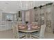 Bright kitchen with white cabinets, quartz countertops, and stainless steel appliances at 2136 Mesic Hammock Way, Venice, FL 34292