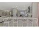 Open concept kitchen with expansive island and seating at 2136 Mesic Hammock Way, Venice, FL 34292