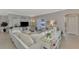 Bright living room featuring a sectional sofa and access to other rooms at 2136 Mesic Hammock Way, Venice, FL 34292