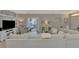 Open living room showcasing a cozy sectional sofa and adjacent areas at 2136 Mesic Hammock Way, Venice, FL 34292