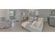 Relaxing living room with a sectional sofa and access to a bathroom at 2136 Mesic Hammock Way, Venice, FL 34292