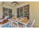 Outdoor patio with seating area and view of the backyard at 2136 Mesic Hammock Way, Venice, FL 34292