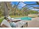 Inviting screened pool with ample lounge space at 2136 Mesic Hammock Way, Venice, FL 34292