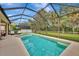 Large screened in pool with a spacious deck at 2136 Mesic Hammock Way, Venice, FL 34292