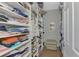 Large walk-in closet with ample shelving and hanging space for clothes and shoes at 2136 Mesic Hammock Way, Venice, FL 34292