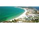 Aerial view of coastline with beach and buildings at 2280 Stickney Point Rd # 437, Sarasota, FL 34231