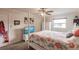 Bedroom with a post bed, TV, and coastal decor at 2280 Stickney Point Rd # 437, Sarasota, FL 34231