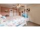 Main bedroom with a post bed, TV, and coastal decor at 2280 Stickney Point Rd # 437, Sarasota, FL 34231