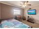 Small bedroom with twin bed and wooden desk at 2280 Stickney Point Rd # 437, Sarasota, FL 34231