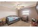 Small bedroom with twin bed and wooden desk at 2280 Stickney Point Rd # 437, Sarasota, FL 34231