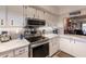 Bright kitchen, stainless steel appliances, and granite countertops at 2280 Stickney Point Rd # 437, Sarasota, FL 34231