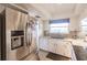 Modern kitchen with stainless steel appliances and granite countertops at 2280 Stickney Point Rd # 437, Sarasota, FL 34231