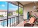 Relaxing lanai with pool view and comfortable seating at 2280 Stickney Point Rd # 437, Sarasota, FL 34231