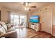 Living room with hardwood floors and access to a balcony at 2280 Stickney Point Rd # 437, Sarasota, FL 34231