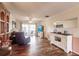 Bright living room features hardwood floors and sliding glass doors at 2280 Stickney Point Rd # 437, Sarasota, FL 34231
