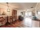 Spacious living room with hardwood floors and access to a balcony at 2280 Stickney Point Rd # 437, Sarasota, FL 34231