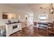Living area with hardwood floors and built-in storage at 2280 Stickney Point Rd # 437, Sarasota, FL 34231