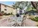 Outdoor patio furniture with a grill at 2280 Stickney Point Rd # 437, Sarasota, FL 34231