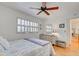 Bedroom with a queen bed and access to a balcony at 232 Saint Augustine Ave # 105, Venice, FL 34285