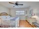 Spacious bedroom with a queen bed and dresser at 232 Saint Augustine Ave # 105, Venice, FL 34285