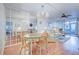 Charming dining area with a light teal table and mirrored room divider at 232 Saint Augustine Ave # 105, Venice, FL 34285