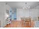 Bright dining area features light teal table and chairs, and mirrored wall at 232 Saint Augustine Ave # 105, Venice, FL 34285