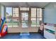 Enclosed lanai with outdoor furniture and pool view at 232 Saint Augustine Ave # 105, Venice, FL 34285
