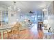 Spacious living area with hardwood floors, comfy seating, and a charming chandelier at 232 Saint Augustine Ave # 105, Venice, FL 34285