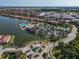 Aerial view of community pool, tennis courts, and clubhouse at 232 Teramo Way, Nokomis, FL 34275