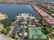 Community pool, tennis courts, and clubhouse with parking at 232 Teramo Way, Nokomis, FL 34275