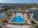 Community pool with lounge chairs and fire pit at 232 Teramo Way, Nokomis, FL 34275