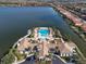 Resort-style community pool with surrounding lounge area at 232 Teramo Way, Nokomis, FL 34275