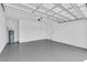 Bright and spacious garage with epoxy flooring and ample storage at 232 Teramo Way, Nokomis, FL 34275