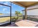 Screened porch overlooking a lake at 232 Teramo Way, Nokomis, FL 34275