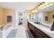 Bathroom with double vanity and soaking tub at 23619 Awabuki Dr, Venice, FL 34293