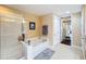 Bathroom with shower and soaking tub at 23619 Awabuki Dr, Venice, FL 34293