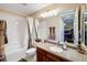 Clean bathroom with tub, shower, and a vanity with granite countertop at 23619 Awabuki Dr, Venice, FL 34293