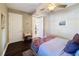 Bright bedroom featuring a double bed and access to other rooms at 23619 Awabuki Dr, Venice, FL 34293