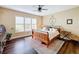 Bedroom with wooden bed frame and window seating at 23619 Awabuki Dr, Venice, FL 34293